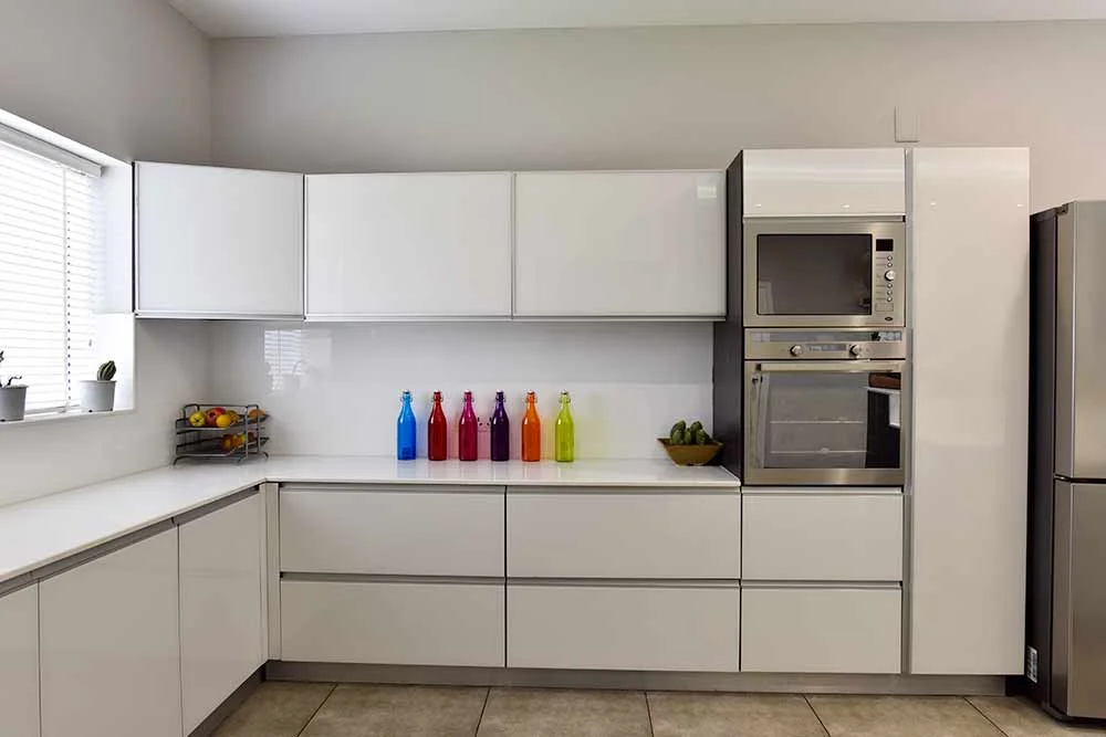 interior-designers-in-idukki-white-high-gloss-kitchen